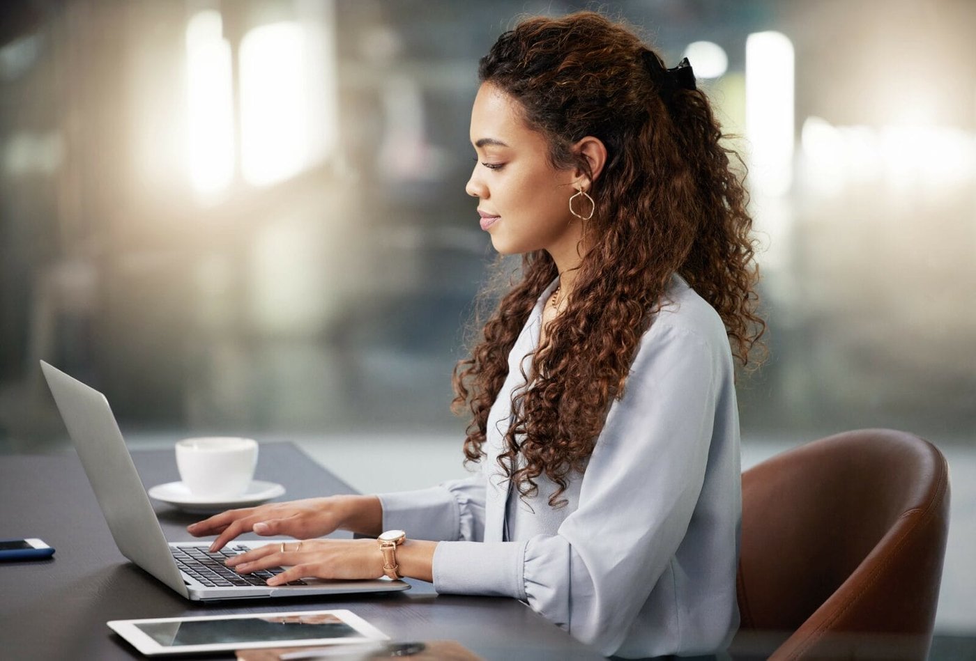 Focus, laptop and search with business woman in office for social media, networking and corporate. Website, planning and technology with employee in digital agency for entrepreneur, internet or email work